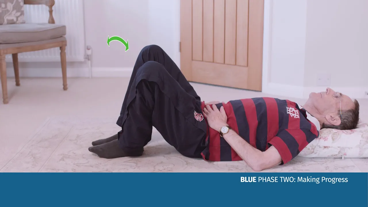 a person doing an exercise on the floor